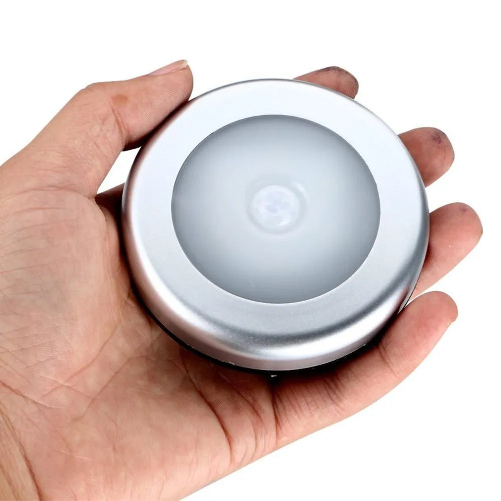 Silver square wireless motion sensor night light for cupboards and hallways.