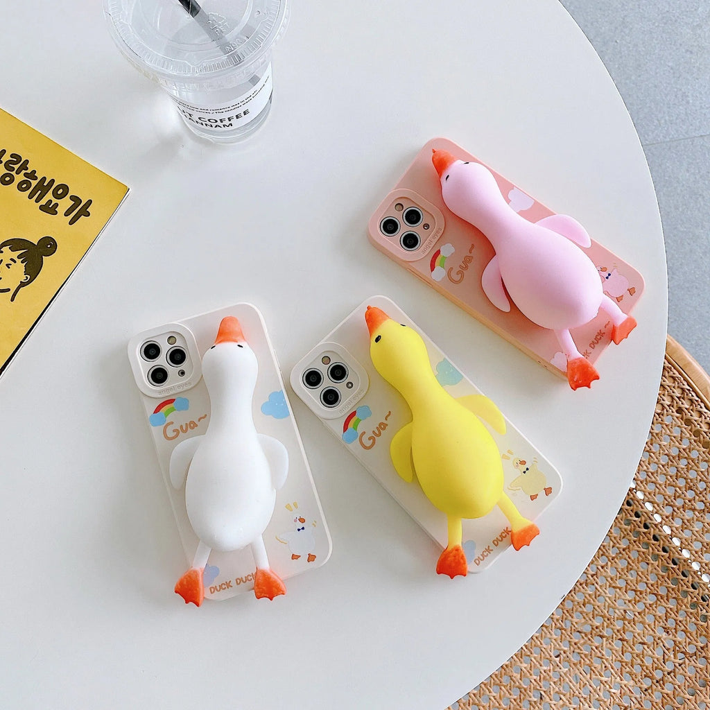 Cartoon-printed silicone TPU phone case for Apple iPhone in yellow, white, and pink colour options.