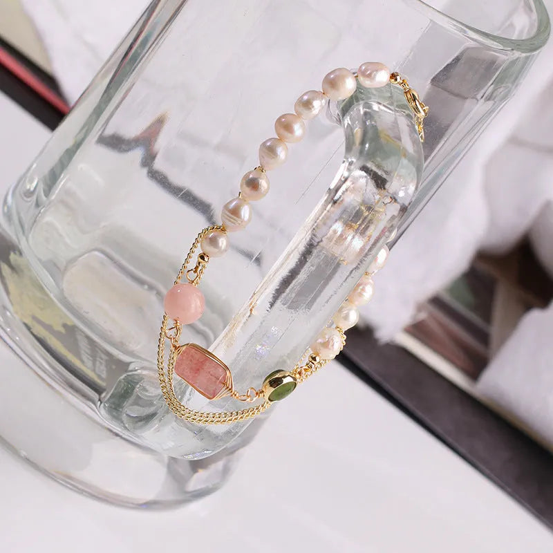 Women's pink freshwater pearl bracelet with strawberry crystal charm geometric design