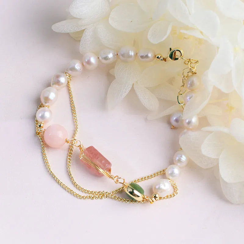 Women's pink freshwater pearl bracelet with strawberry crystal charm geometric design