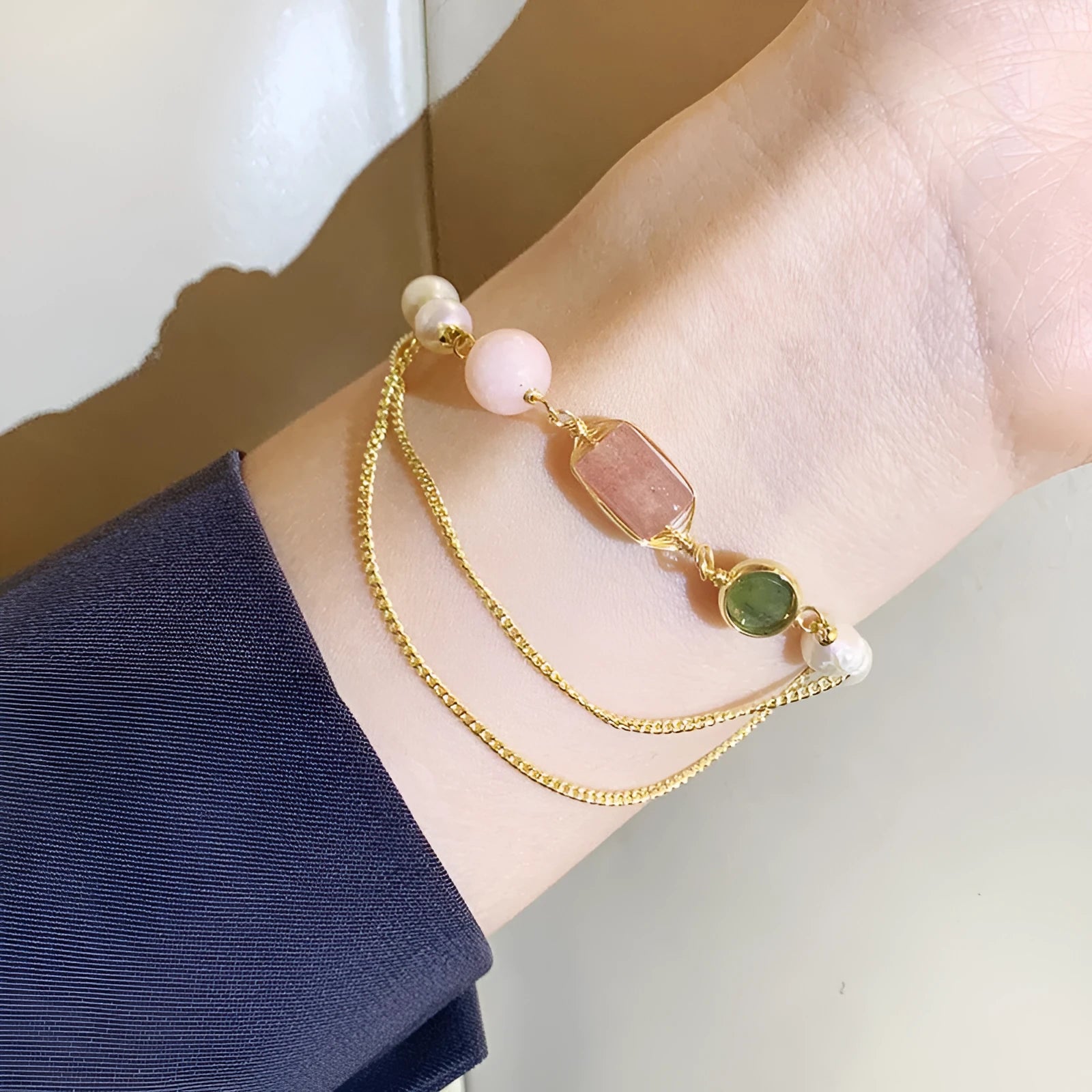 Women's pink freshwater pearl bracelet with strawberry crystal charm geometric design
