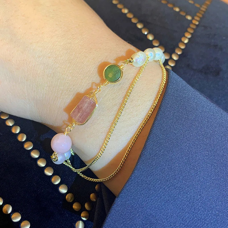 Women's pink freshwater pearl bracelet with strawberry crystal charm geometric design