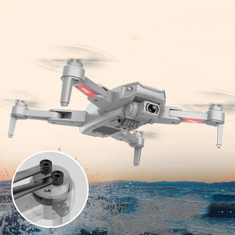 S608 PRO quadcopter in orange with dual cameras, foldable propellers, and GPS module on black background