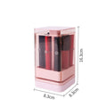 Pink press-lift lipstick storage box with dust cover on a desktop.