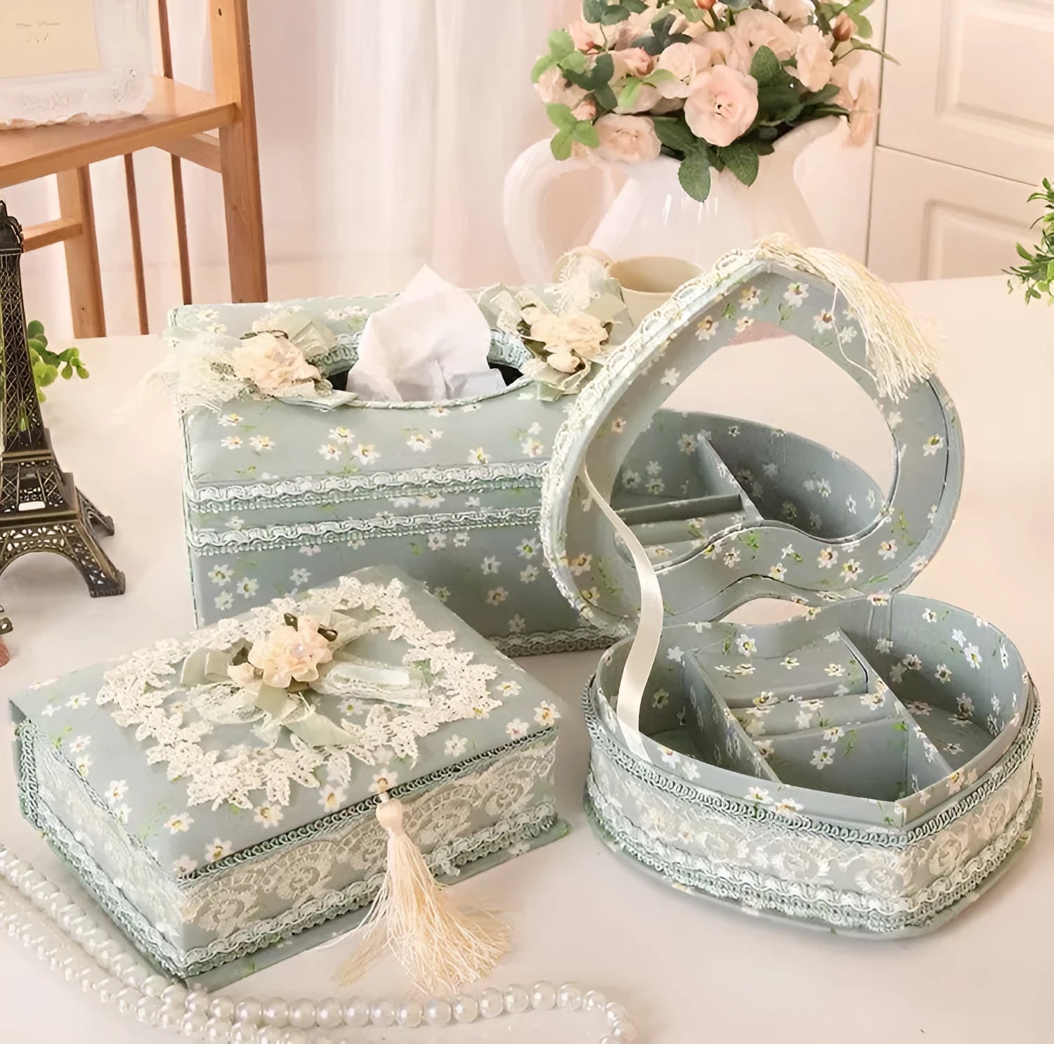 Ceramic jewellery and tissue storage box in bright apricot colour on a table.