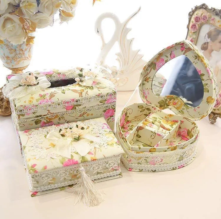 Ceramic jewellery and tissue storage box in bright apricot colour on a table.
