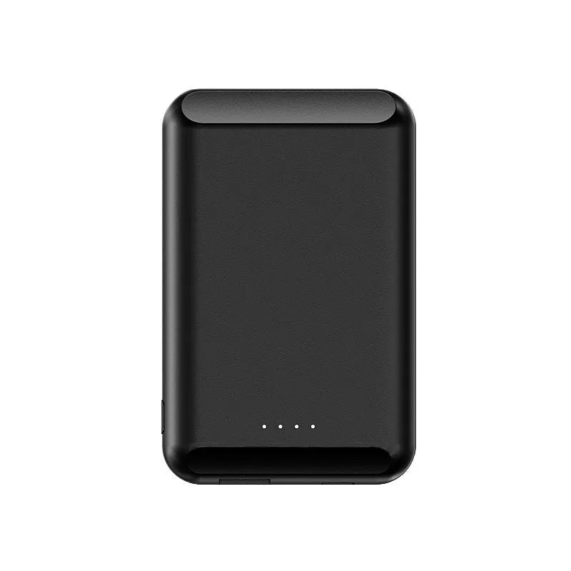 A black magnetic wireless power bank attached to the back of an iPhone for charging.