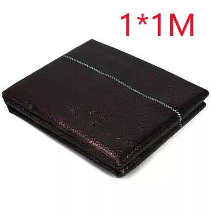 Black plastic weed control cloth laid flat showing composite woven texture and rectangular shape