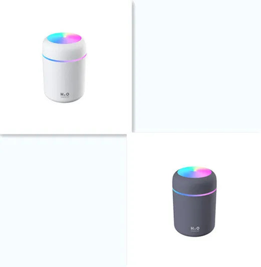 Pink portable car humidifier with coloured lights on a car dashboard next to a USB cable