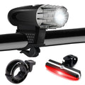 USB rechargeable bike headlight in black or white, rainproof plastic, 105x33x90mm, with optional taillight or bell