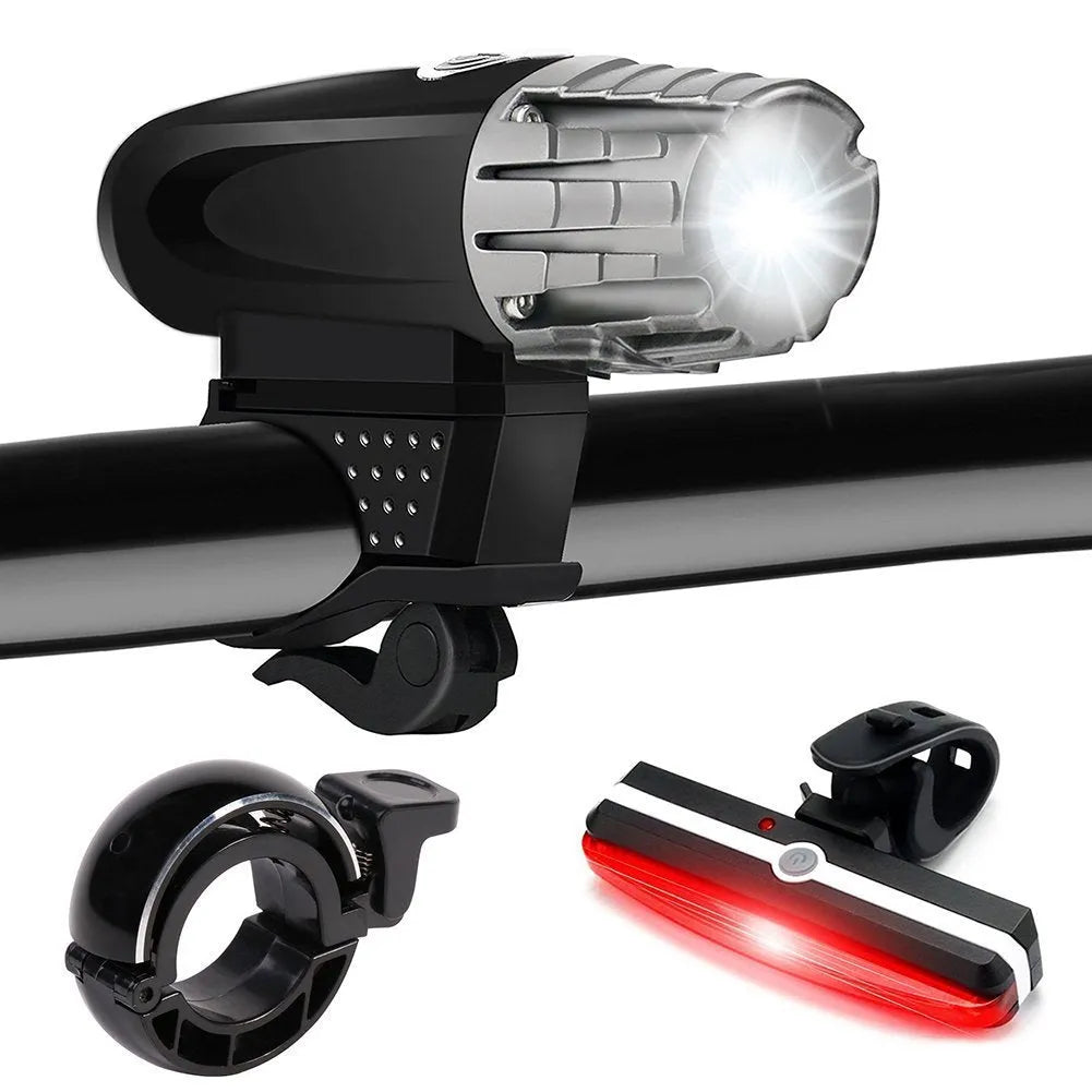 USB rechargeable bike headlight in black or white, rainproof plastic, 105x33x90mm, with optional taillight or bell