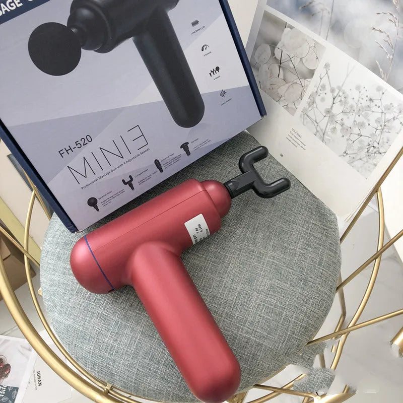 Black, red, and grey fascia gun muscle massager with USB cable