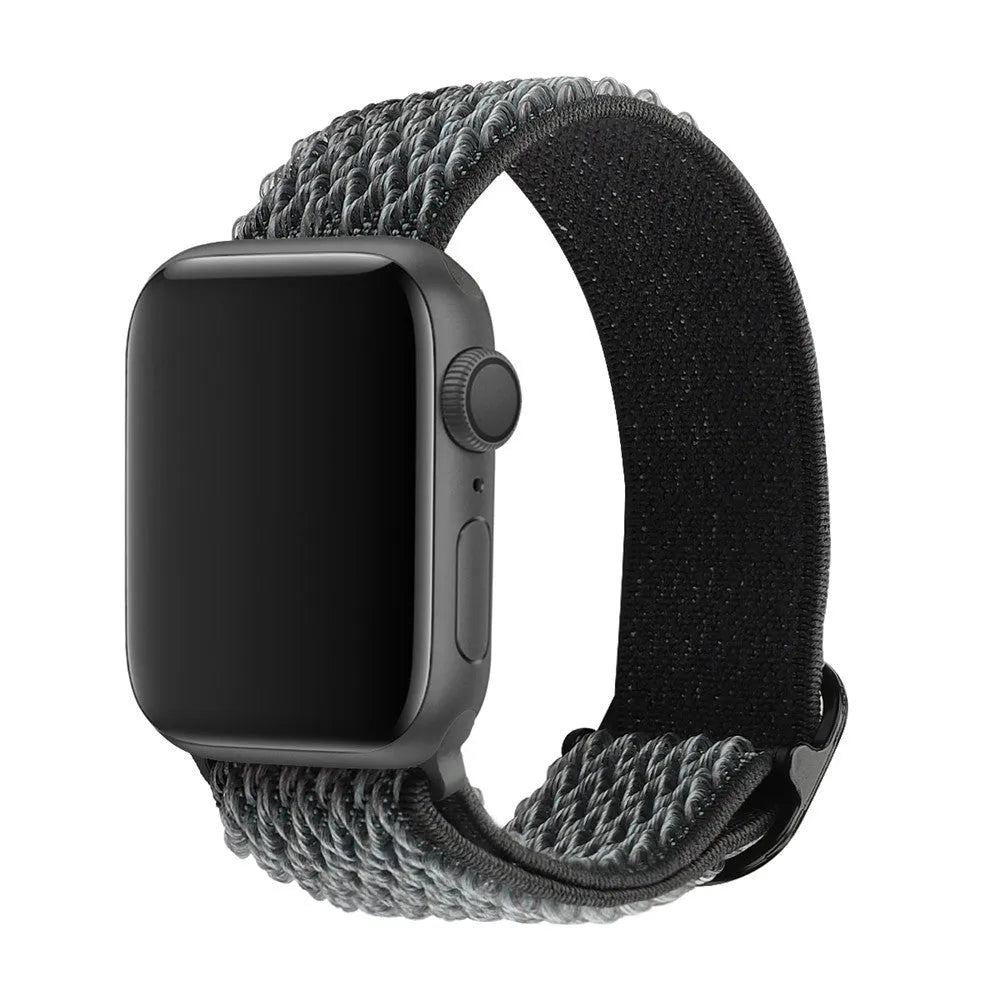 Braided nylon elastic Apple Watch strap in wave pattern, shown in Lilac colour on a wrist.