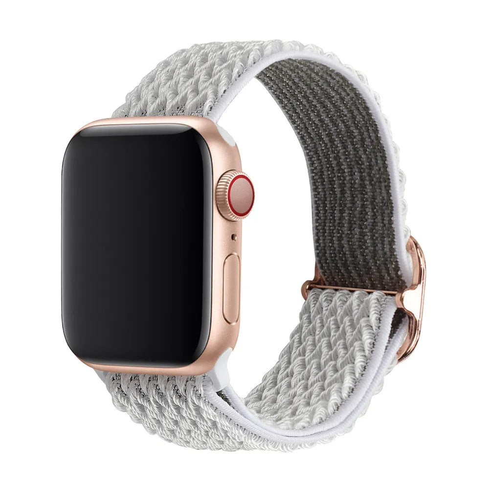 Braided nylon elastic Apple Watch strap in wave pattern, shown in Lilac colour on a wrist.