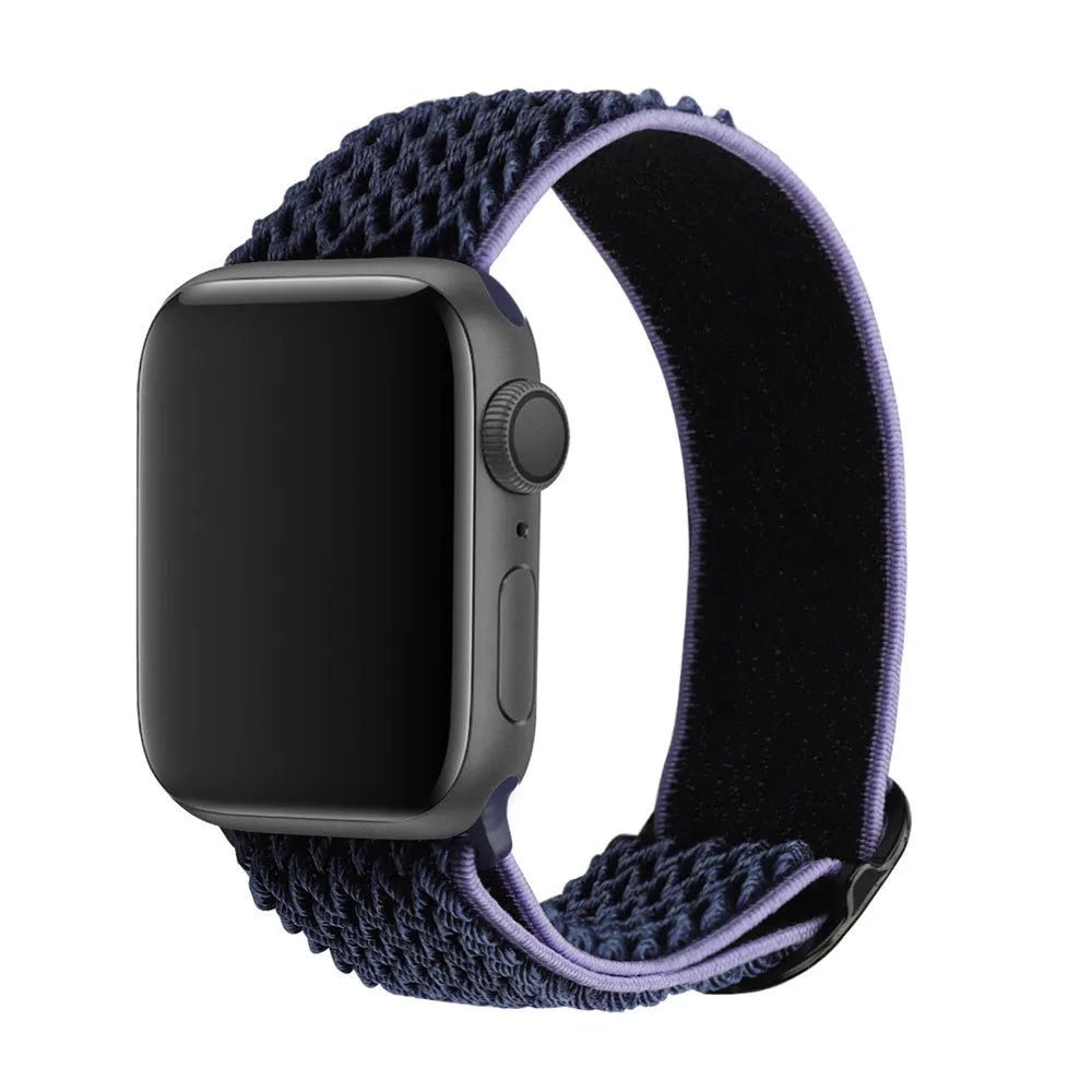 Braided nylon elastic Apple Watch strap in wave pattern, shown in Lilac colour on a wrist.