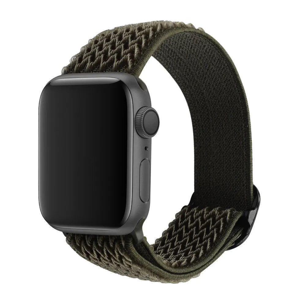 Braided nylon elastic Apple Watch strap in wave pattern, shown in Lilac colour on a wrist.