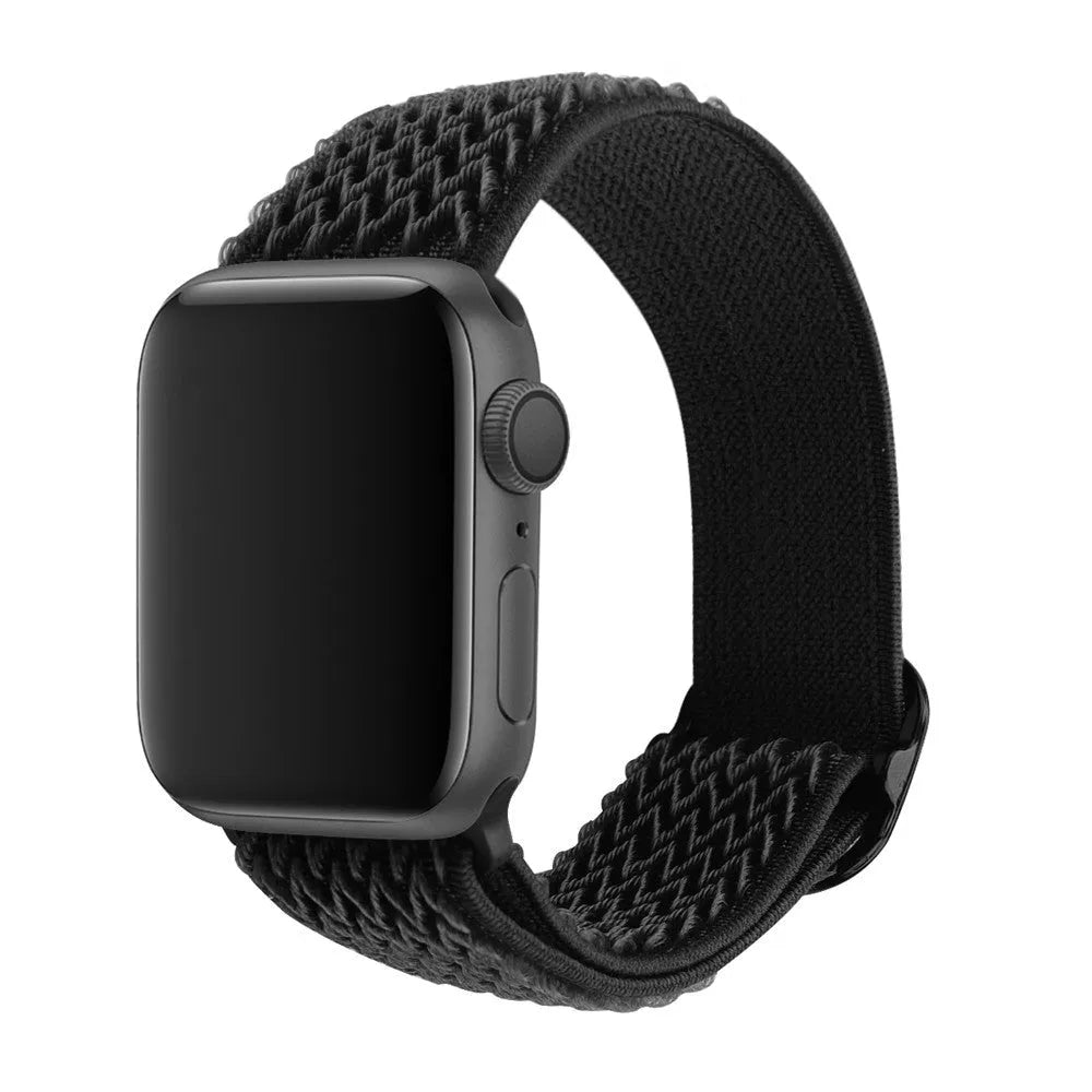 Braided nylon elastic Apple Watch strap in wave pattern, shown in Lilac colour on a wrist.