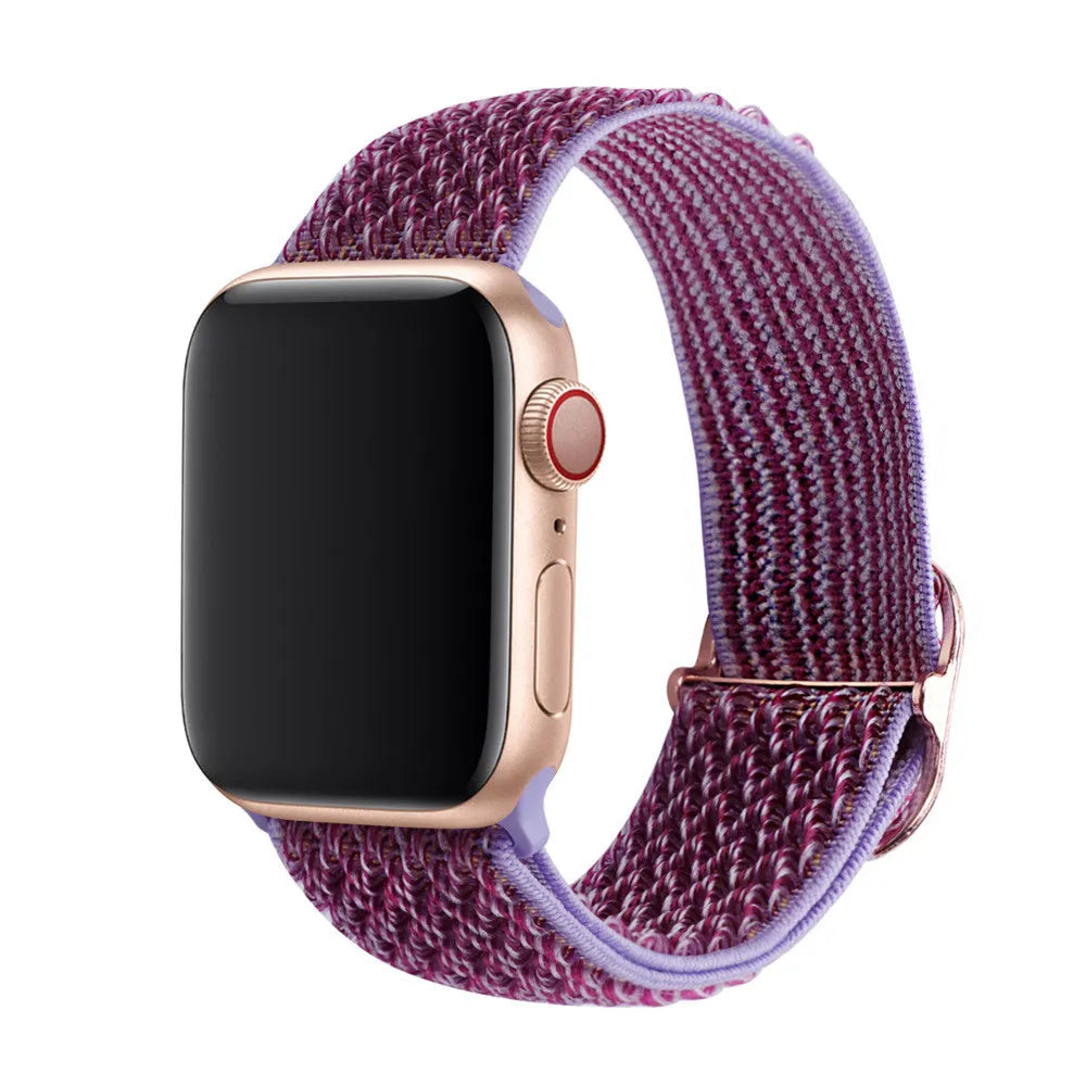 Braided nylon elastic Apple Watch strap in wave pattern, shown in Lilac colour on a wrist.