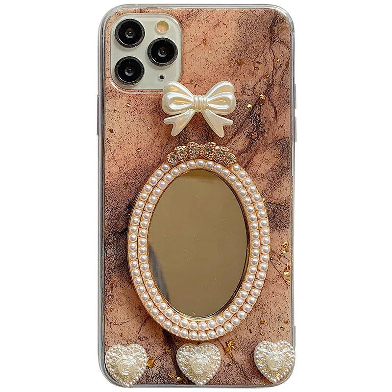 Brown marble pattern silicone iPhone case with rhinestone bowknot and mirror front, shown next to a white colour option.