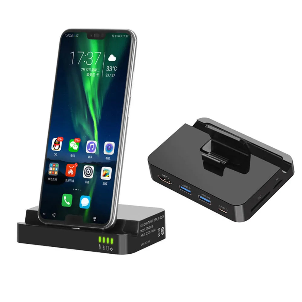Black mobile phone to HDMI dock converter on a table next to a smartphone and HDMI cable.