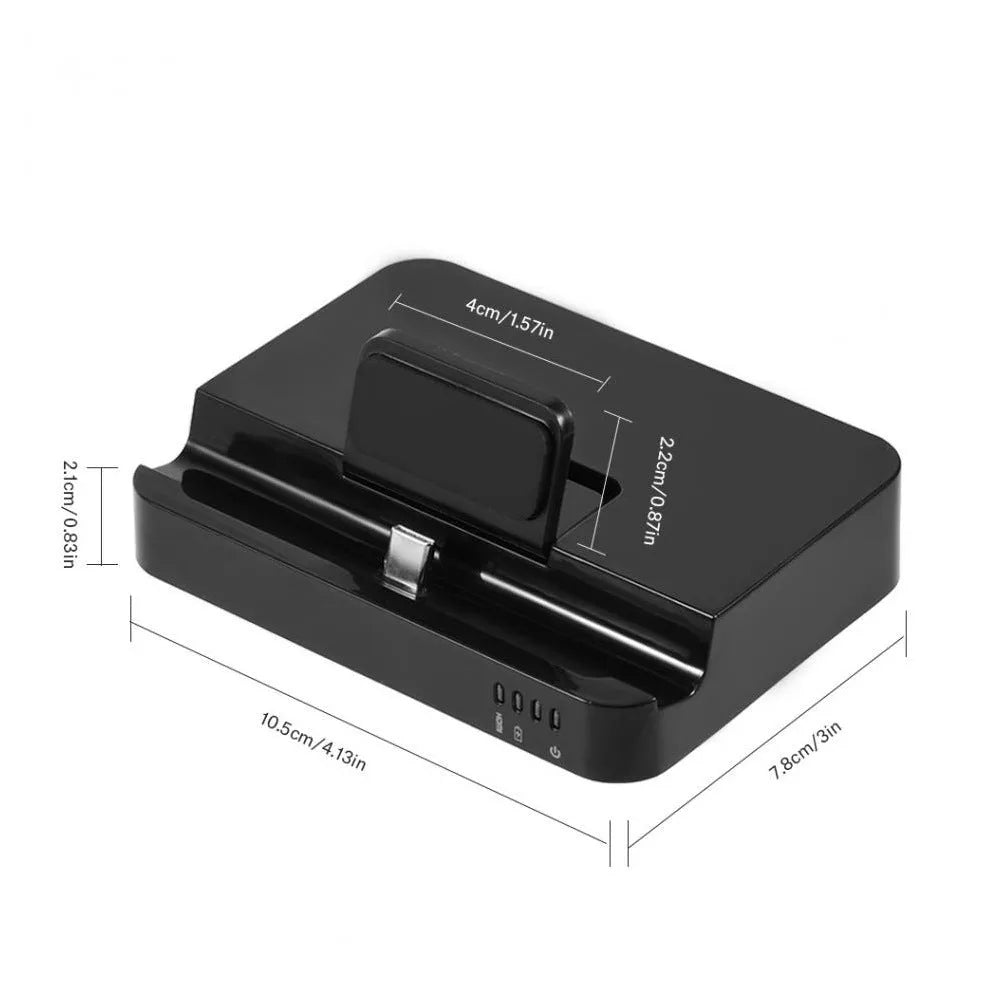 Black mobile phone to HDMI dock converter on a table next to a smartphone and HDMI cable.