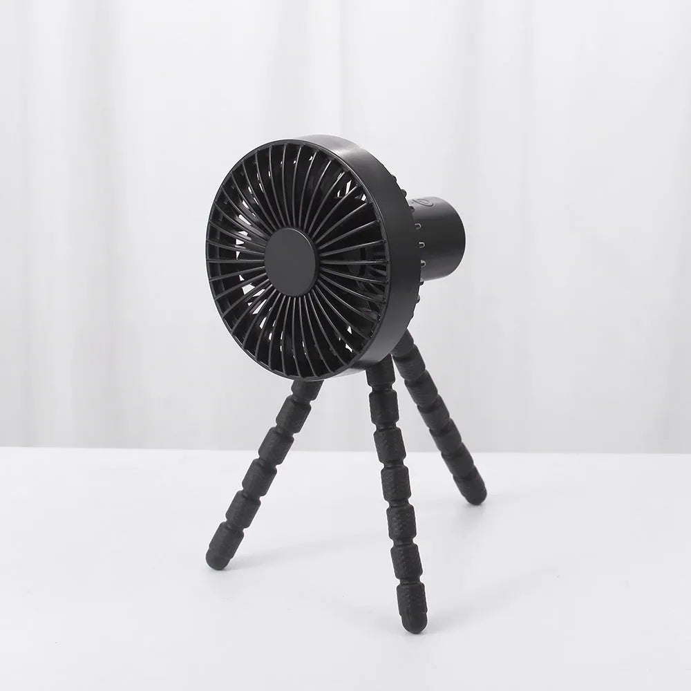 Small adjustable tripod desktop fan with bendable head on octopus stand, shown in white colour.
