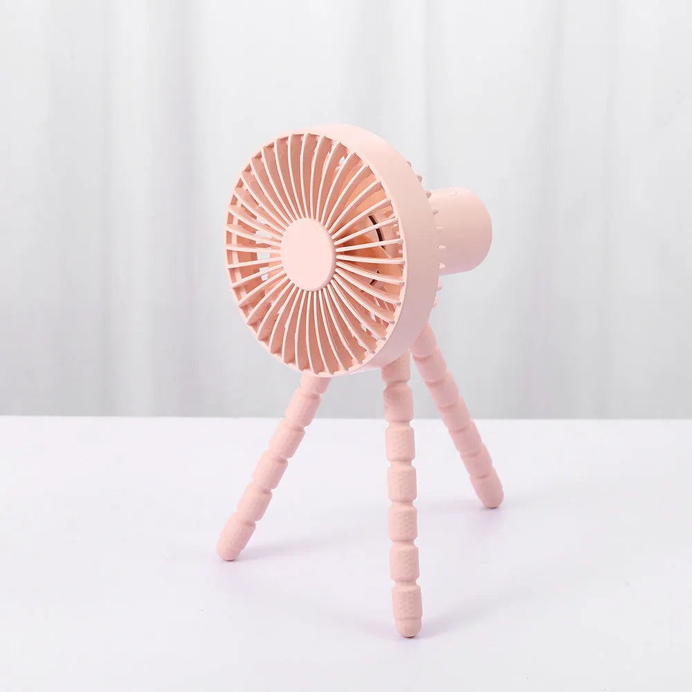 Small adjustable tripod desktop fan with bendable head on octopus stand, shown in white colour.
