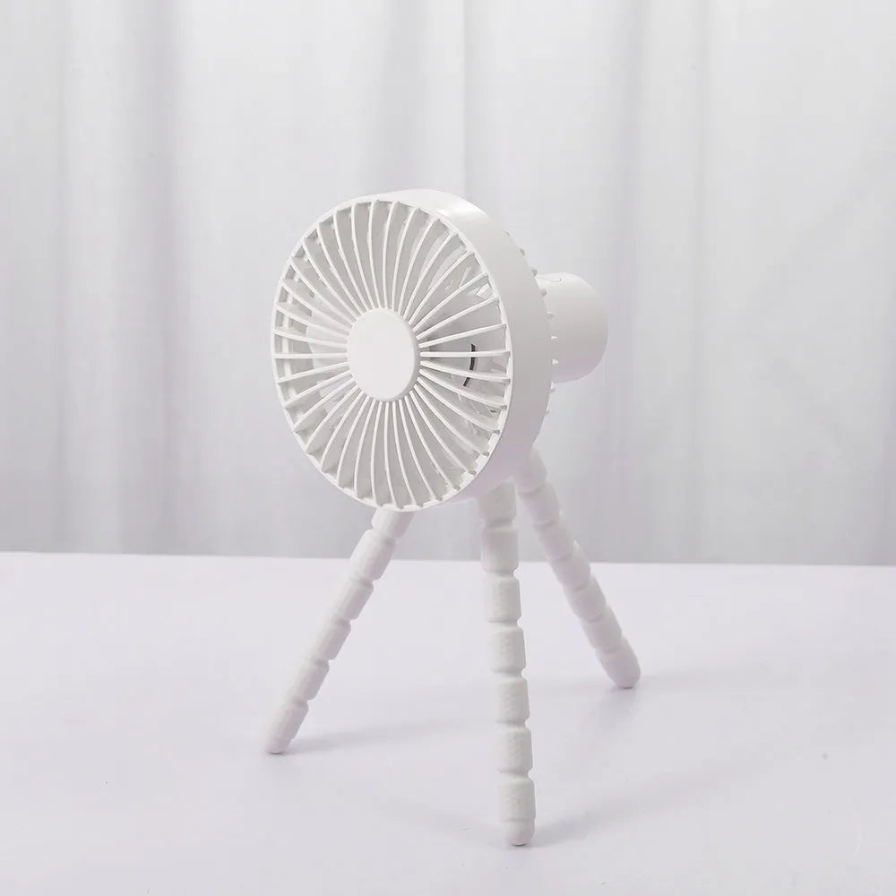 Small adjustable tripod desktop fan with bendable head on octopus stand, shown in white colour.
