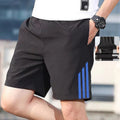Men's three-bar quick-drying cotton fitness shorts in geometric pattern, blue colour, front view
