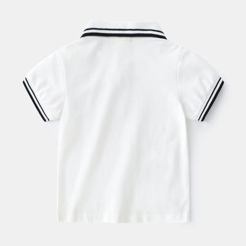 Boys' short sleeve cotton polo t-shirt in white or black, showing round neck and plain front.