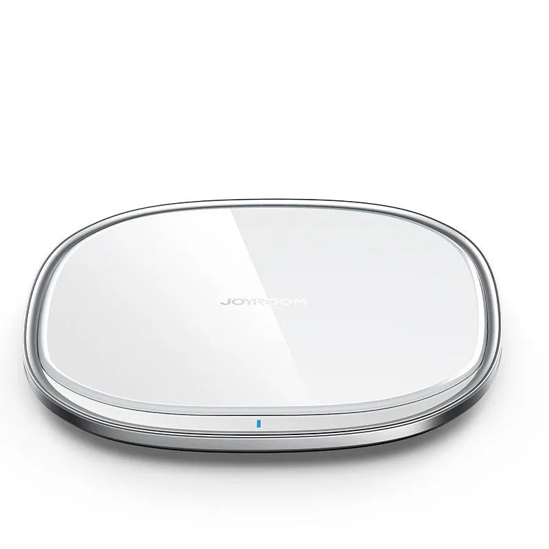 Square black 15W wireless charging pad with glass top and thin zinc alloy frame on a wooden desk