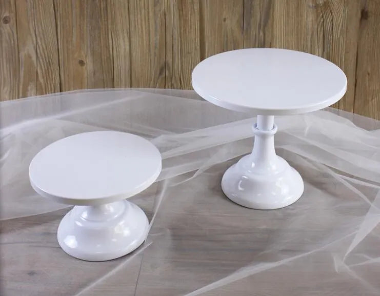 10 inch dessert high tray cake tray in black on a table with cakes and pastries displayed at raised height