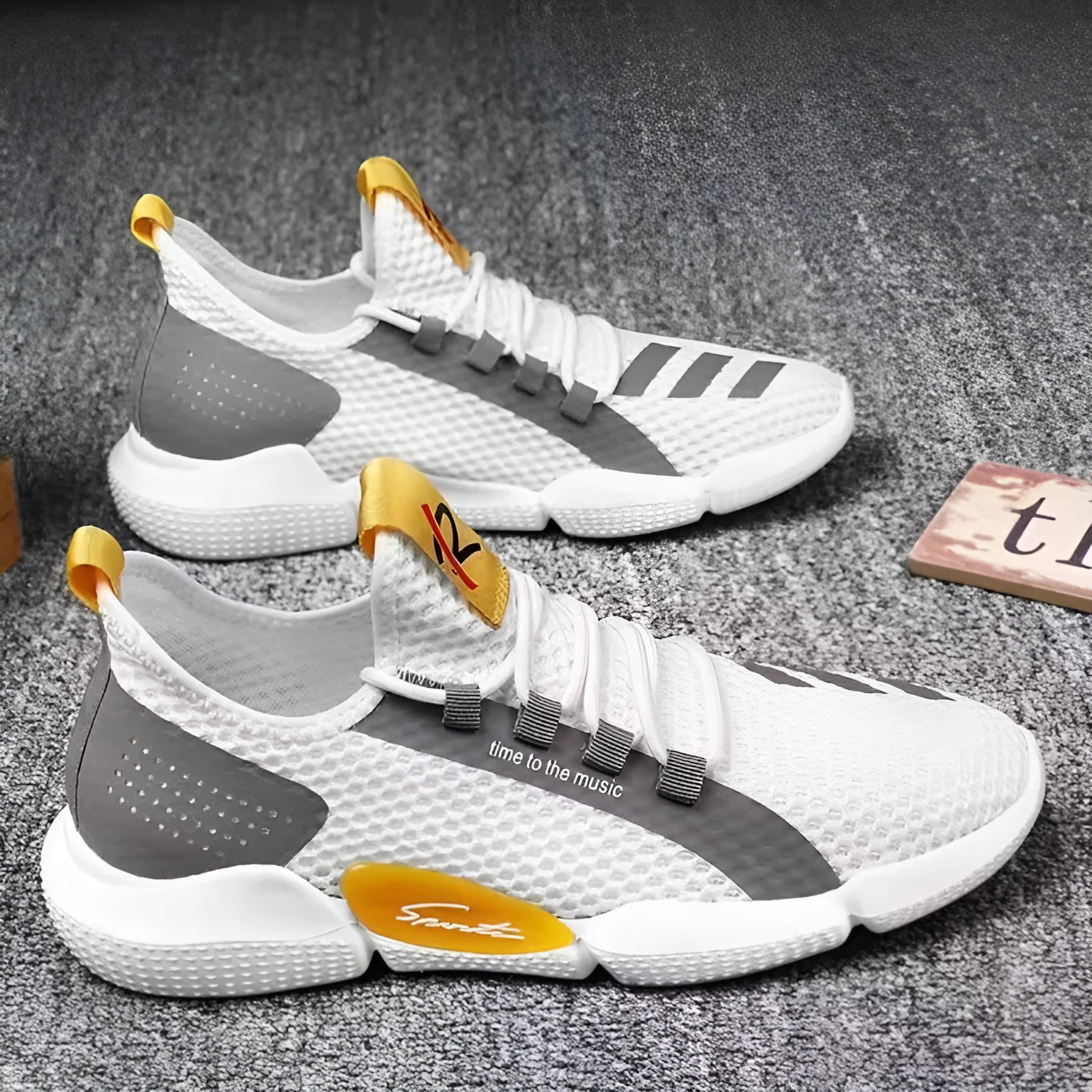 Pair of breathable net lace-up casual sports shoes in black, white, and yellow colour options
