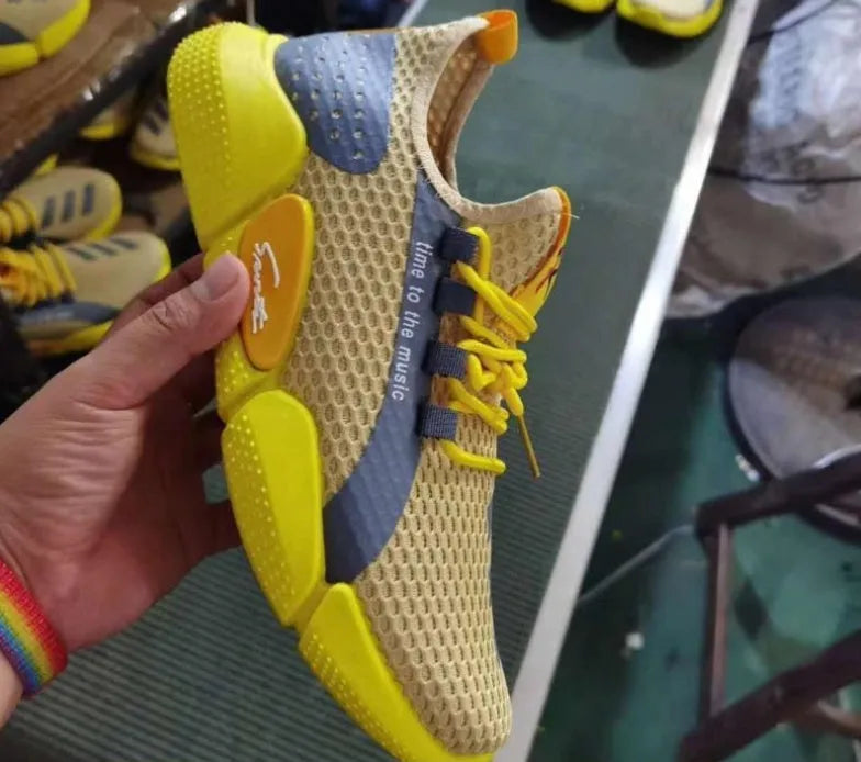 Pair of breathable net lace-up casual sports shoes in black, white, and yellow colour options