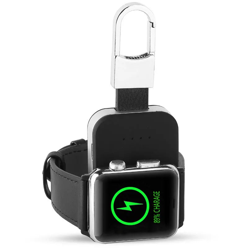 Black Apple Watch portable wireless power bank on a keyring showing compact size.