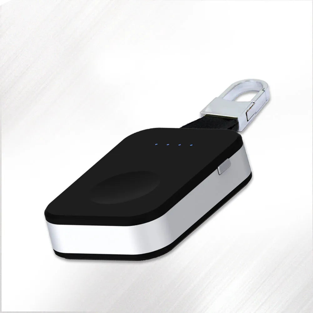 Black Apple Watch portable wireless power bank on a keyring showing compact size.