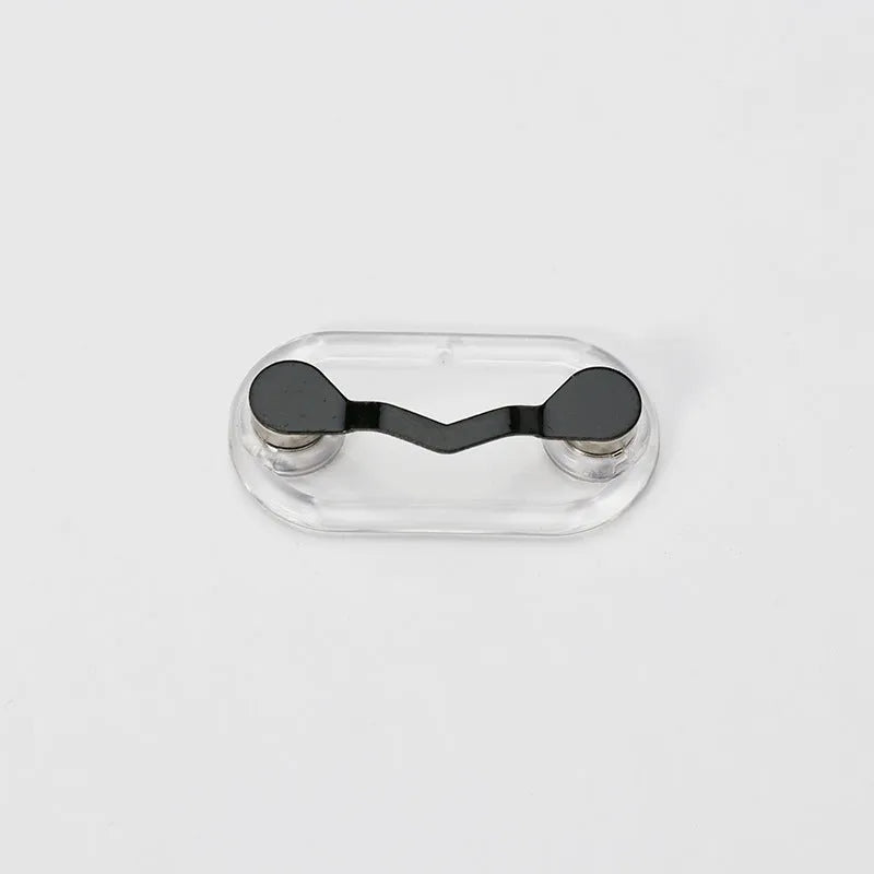 Black magnetic glasses holder on a fridge door with spectacles stored