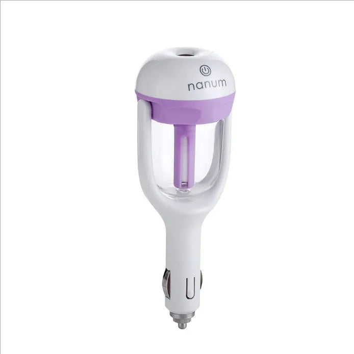 Compact blue portable car humidifier with essential oil diffuser on a car dashboard.