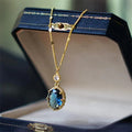 Gold geometric pendant necklace with French retro style on a model.