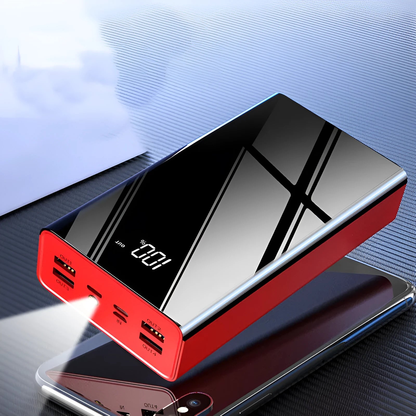 Large black 40000mAh power bank with LCD display showing battery percentage, placed next to a charging cable.