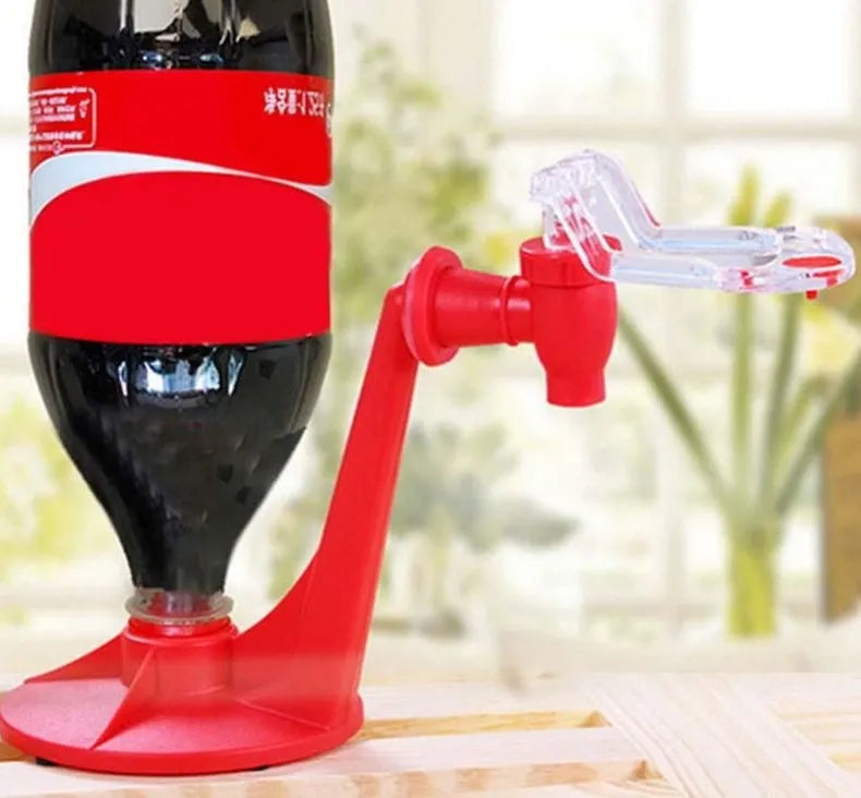 Red plastic Magic Tap soda dispenser attached to an inverted 2-litre bottle
