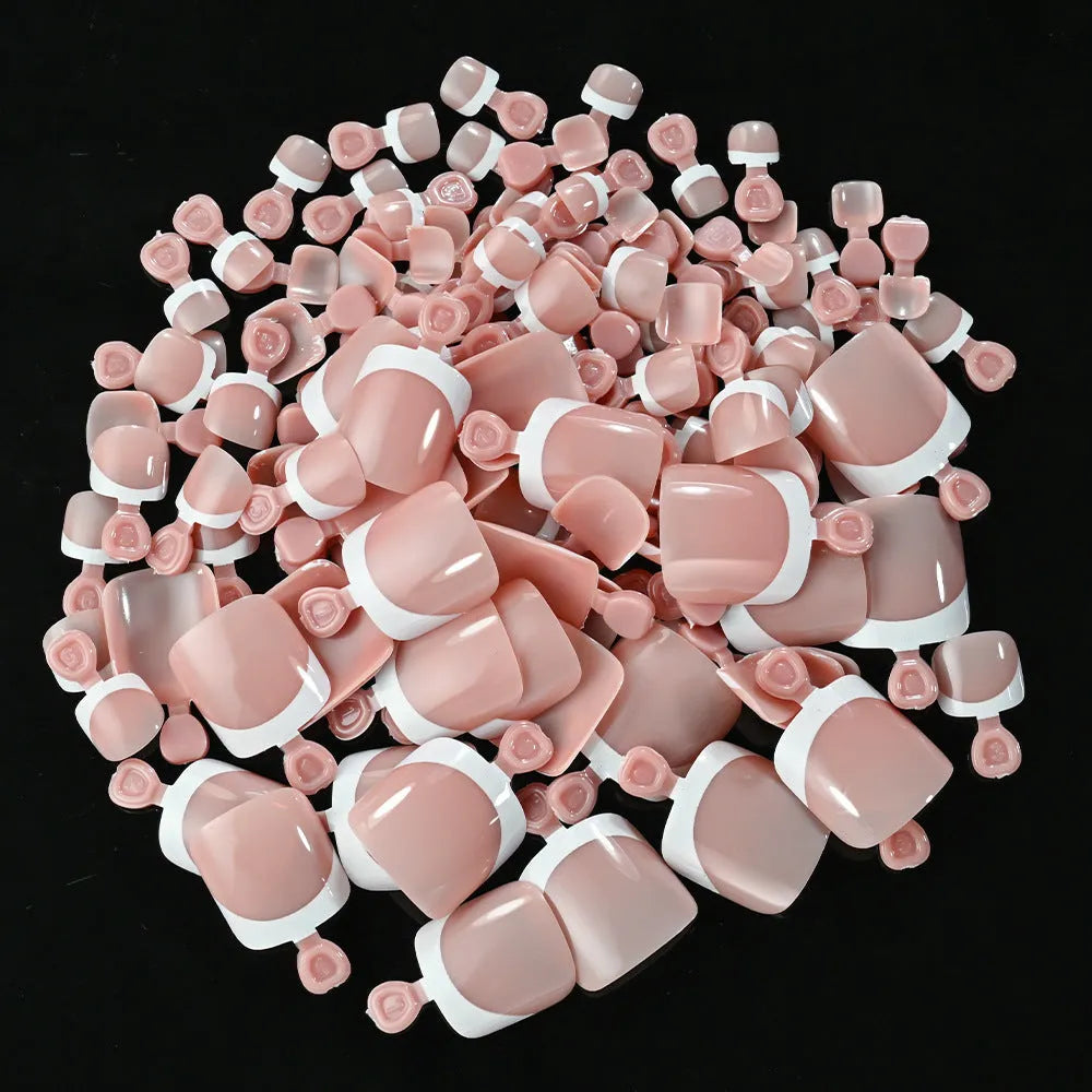 Open box showing 120 French white edge nude square false toe nail pieces in various shades.