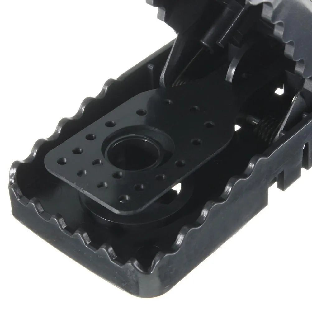 Six black plastic snapping mousetraps with dimensions 11cm long by 5cm wide
