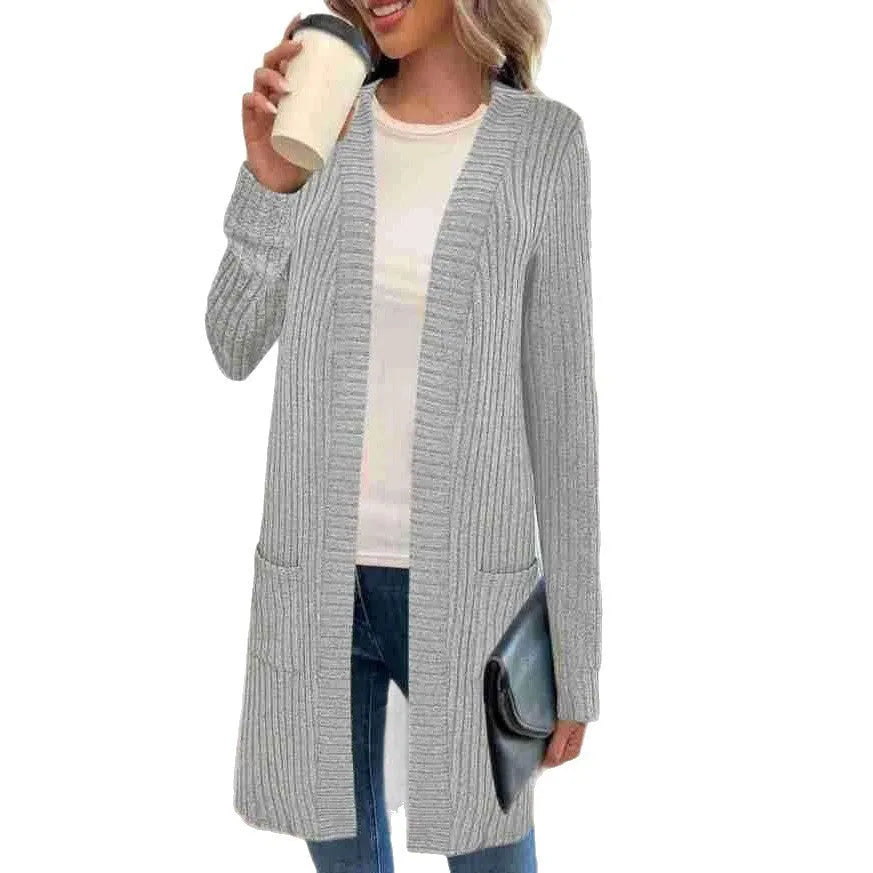 Long sleeve loose cardigan jacket in black, wine red, or grey with pockets, shown on a hanger.