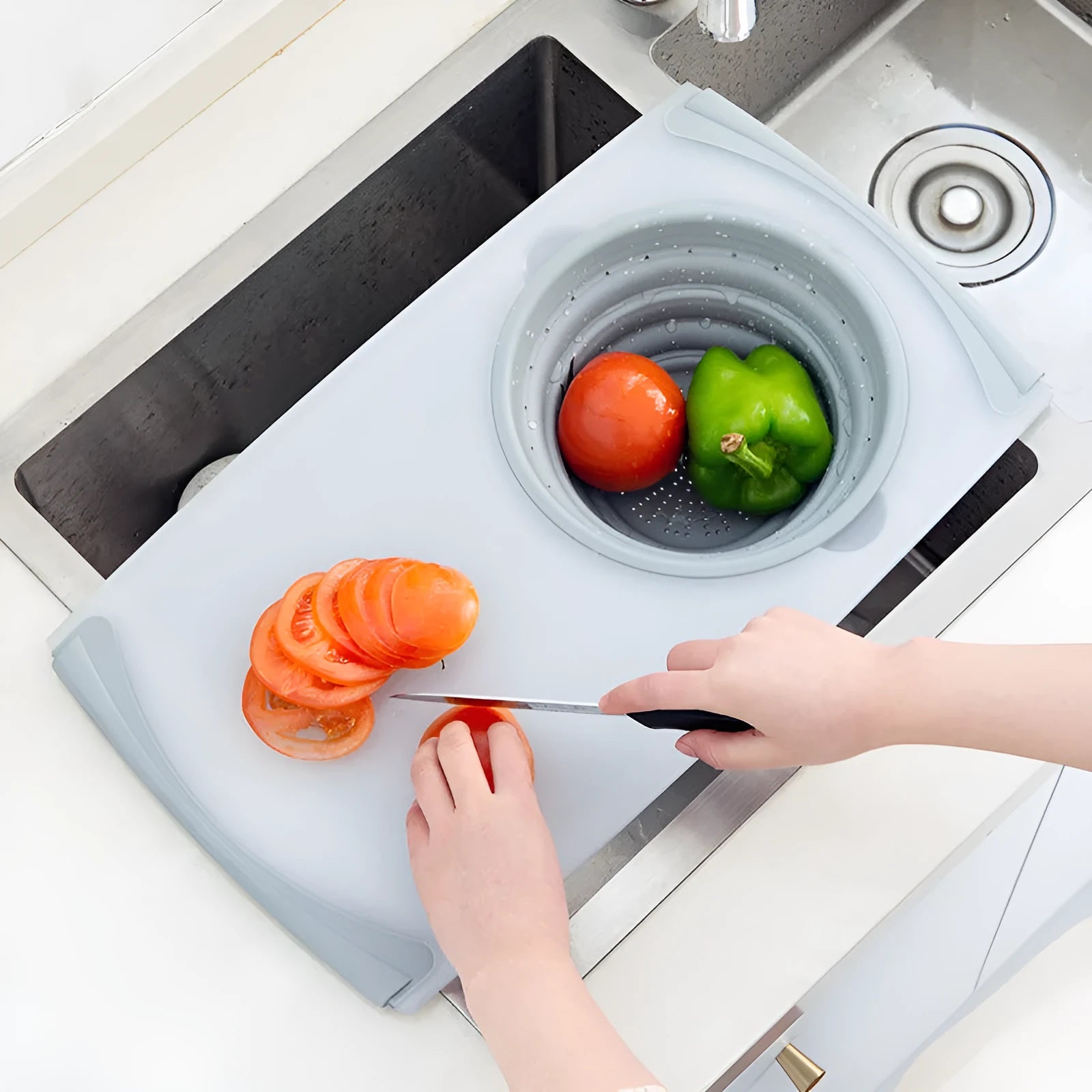 Grey multi-functional chopping board with detachable drain basket showing 50cm cutting surface