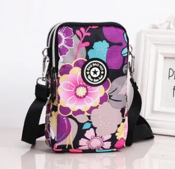 Vertical mobile phone bag in black with Oxford Spinning texture and zipper closure