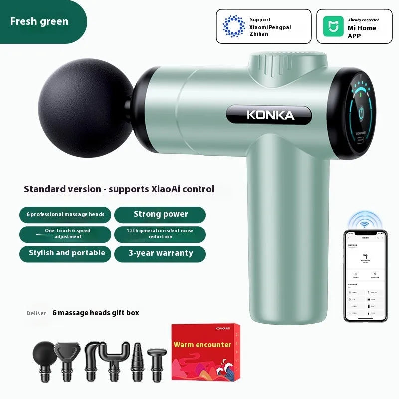 Konka V19 grey massage gun with multiple silicone attachment heads on a table.