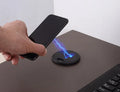 Black 60mm round wireless phone charging pad for furniture installation
