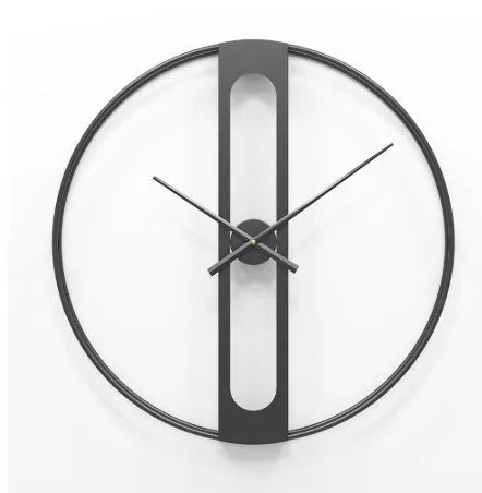 Large round metal wall clock with Roman numerals on a white wall.
