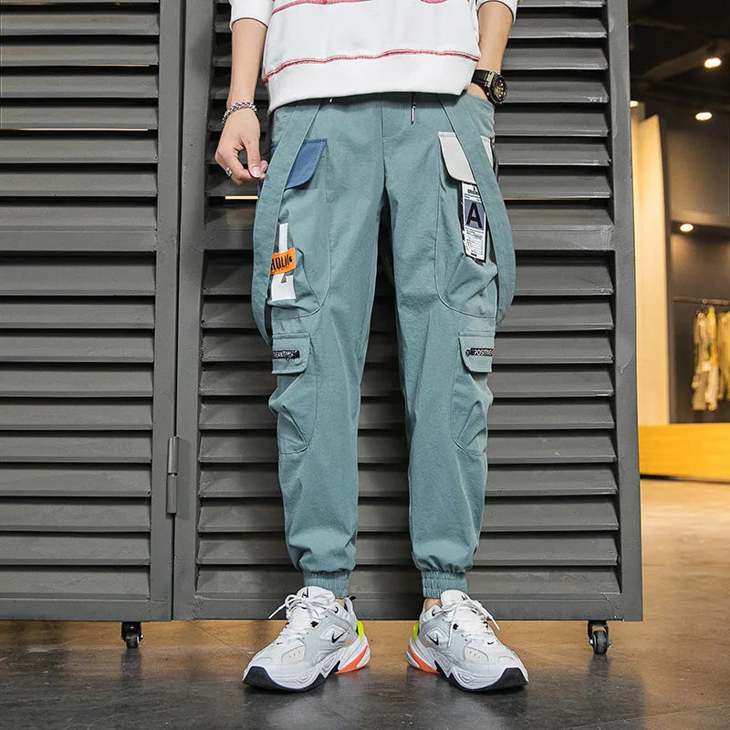 Men's multi-pocket loose fit workwear casual pants in black, grey, and light green with T400 cotton fabric